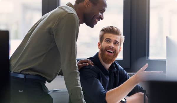 Two professionals working on managing tickets