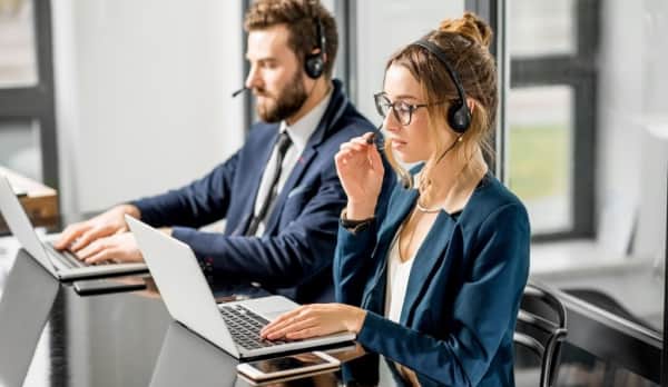 Two receptionist answering calls